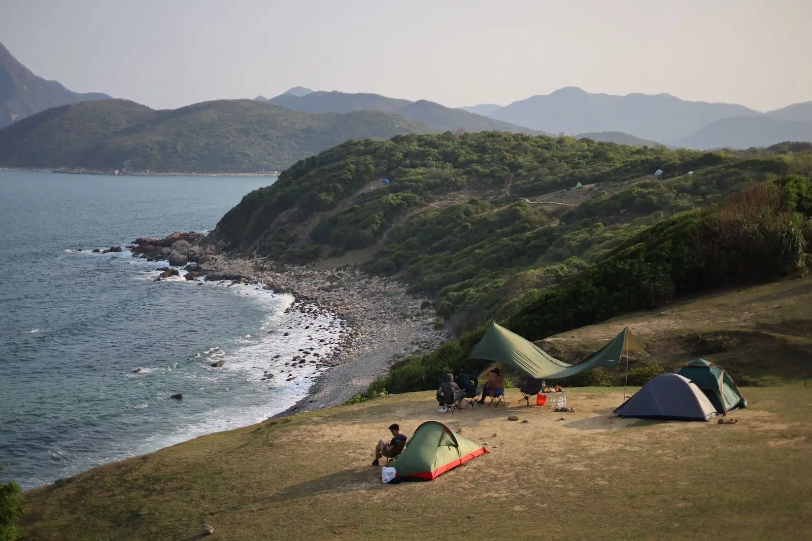 A coastal campsite at dusk