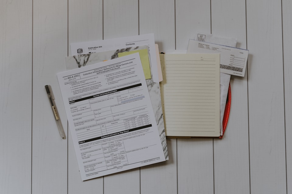 Campsite owner reviewing VAT records and financial documents at a desk