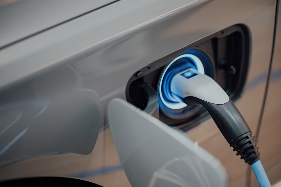 An electric vehicle charging at a campsite charge point